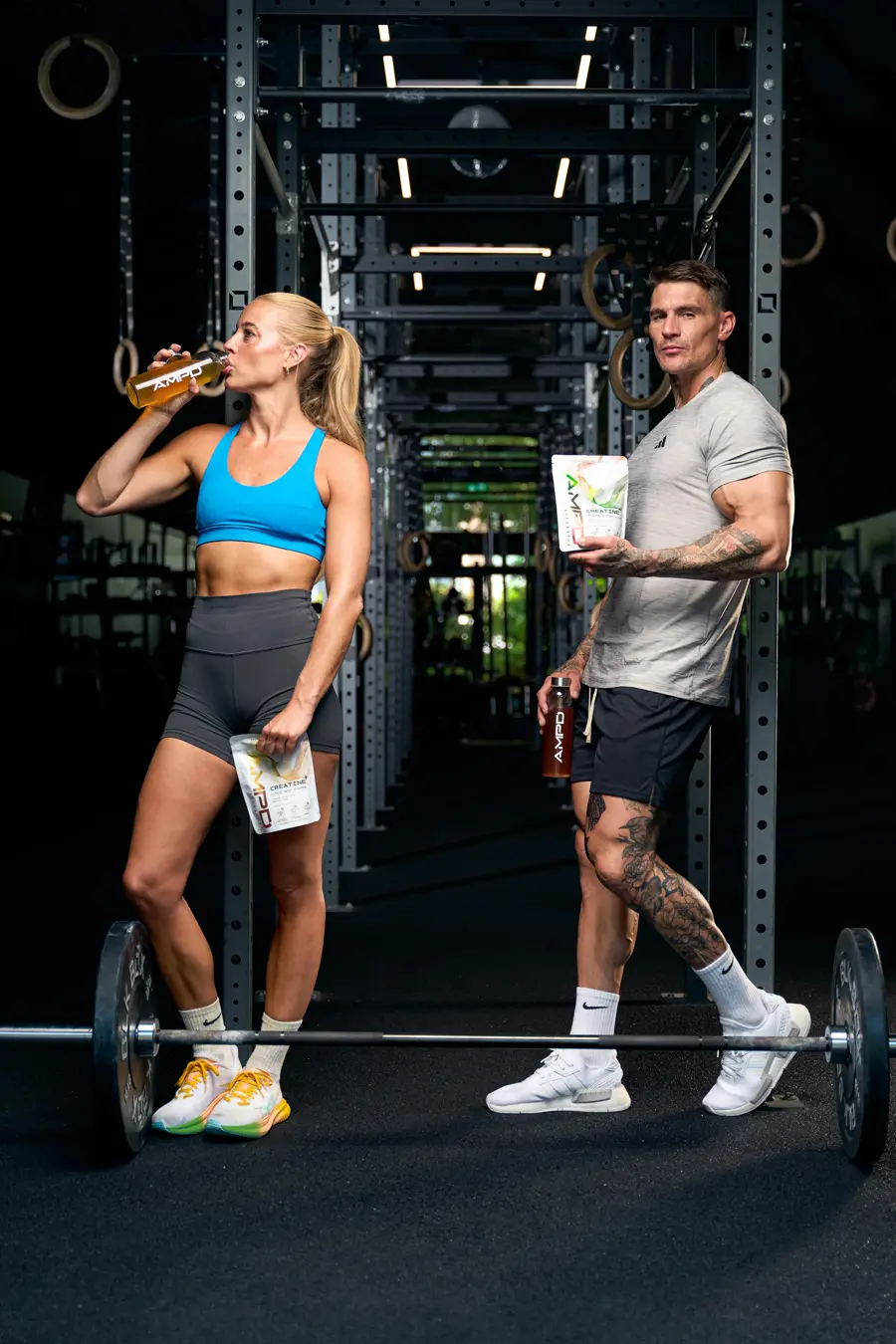 Ross and an athlete in the gym with AMPD Creatine+ bottles and pouches